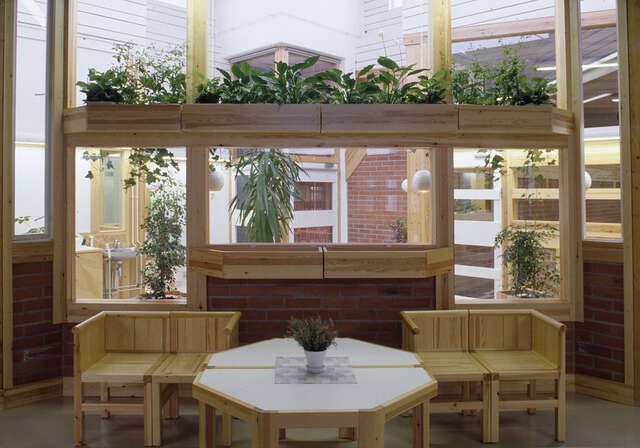 Sitting area with small wooden furniture.