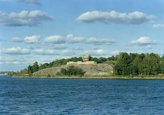 View of the observation tower with its surrounding nature viewed from a boat.