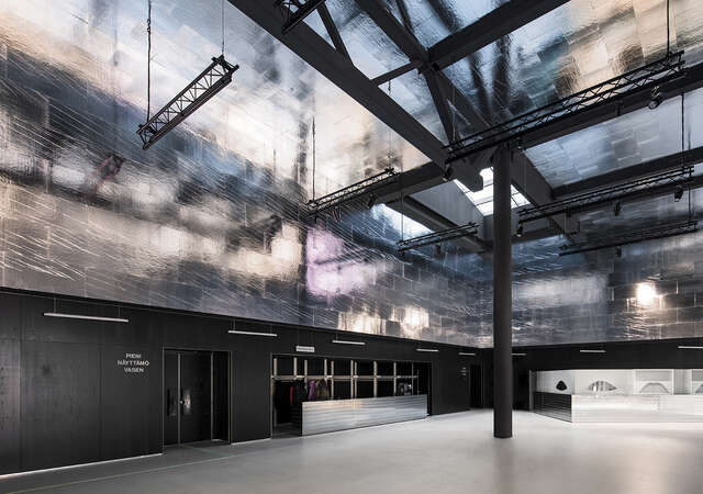 Dark and metallic monochrome interior.