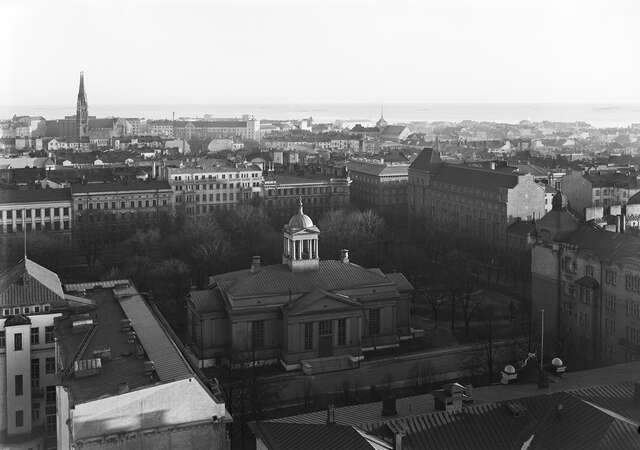 Birds eye view picture of the old church and its surroundings with the sea at the horizon.