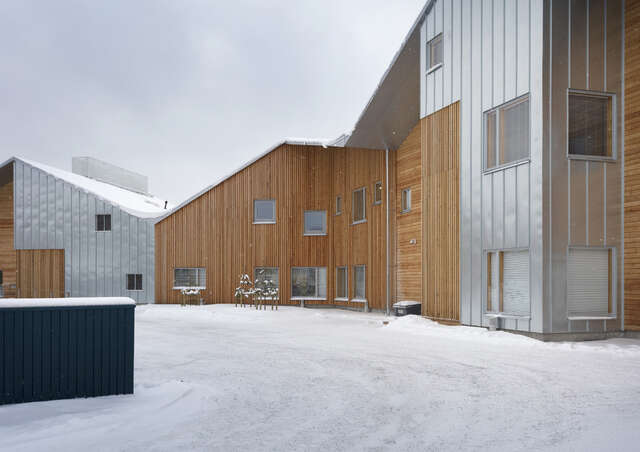 Winter, snow, a folding volume partly covered with timber, partly aluminium