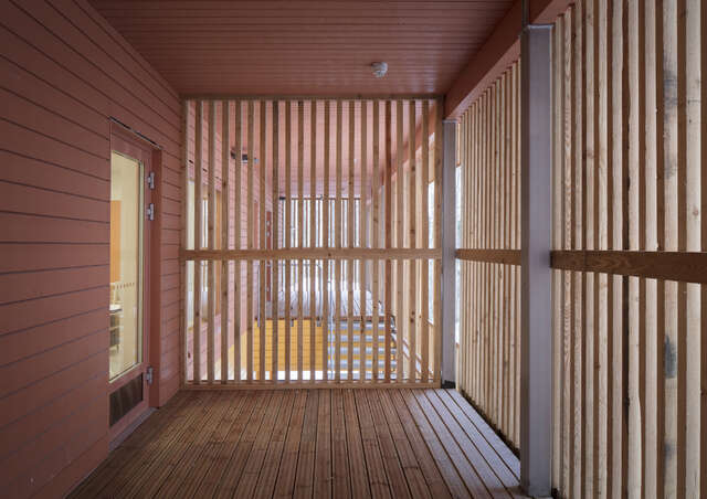 Terrace sheltered by vertical wooden laths