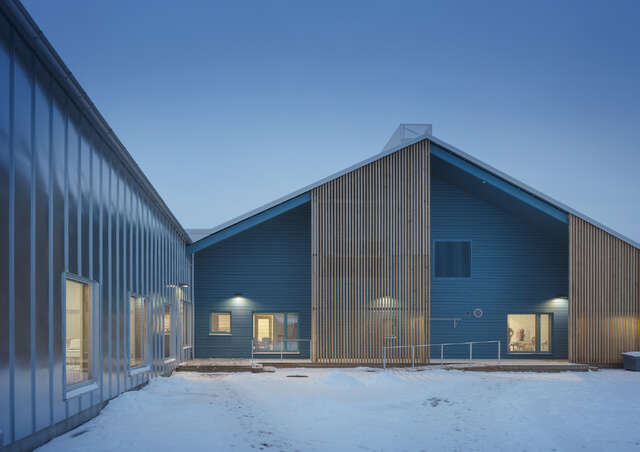Blue moment of the evening, inner corner of a building with a pitched roof