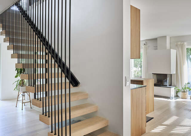 a wooden staircase inside a building with steps leading up