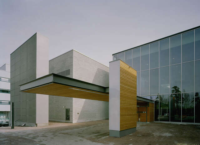 Wooden extending roof over the entrance.