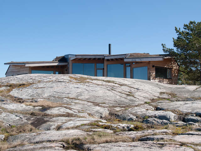 Top of the summer house behind a rock