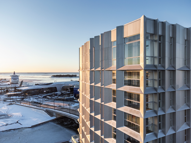 Modern apartment building and scenery in background