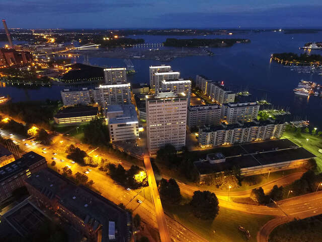Group of high-rise residential buildings next to a sea landscape