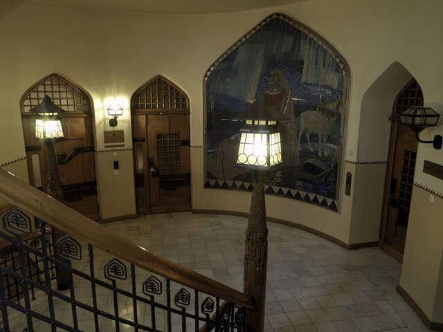 landing with a painting of a woman and a reindeer.