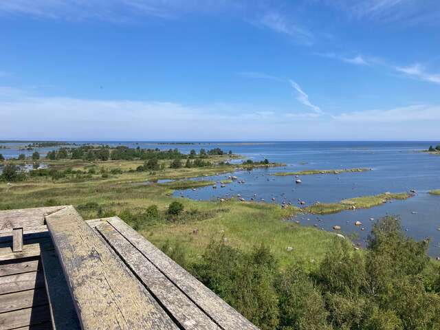 View from top of a tower towards the landscape with scattered strips of land in the sea
