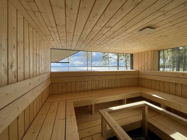 Wooden sauna interior with windows.