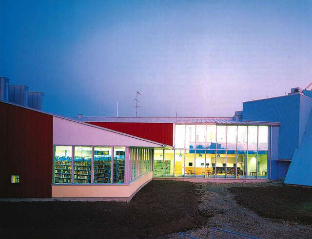 View of the cafeteria and youth club room in the nighttime.