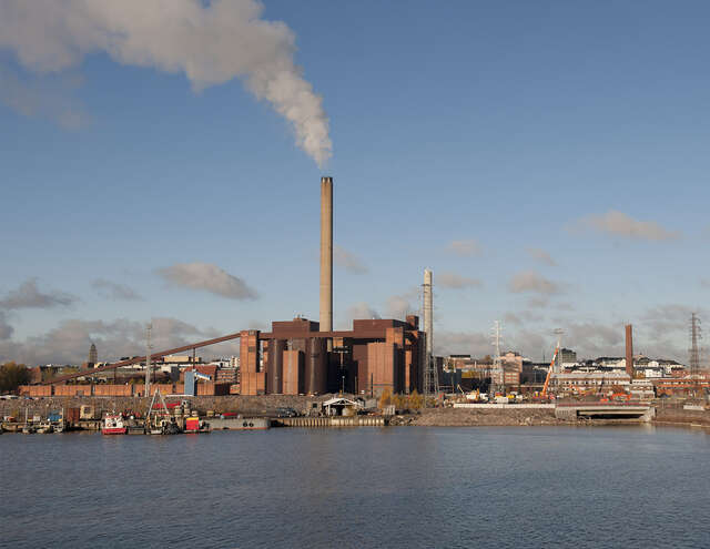 Power plant with high smoking pipe by the sea