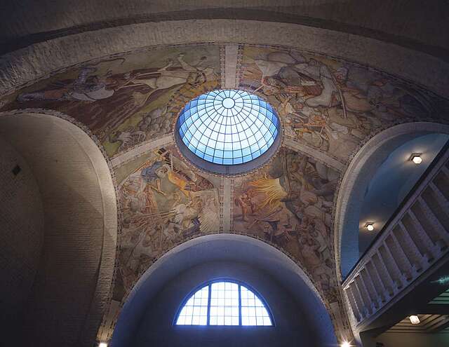 Interior of museum entrance hall with frescoes from the Finnish national epos and an oculus window