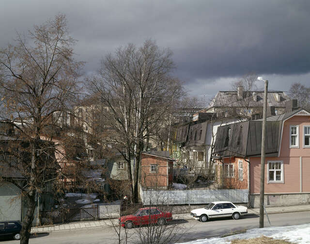 DIfferent coloured wooden houses in a neighborhood.