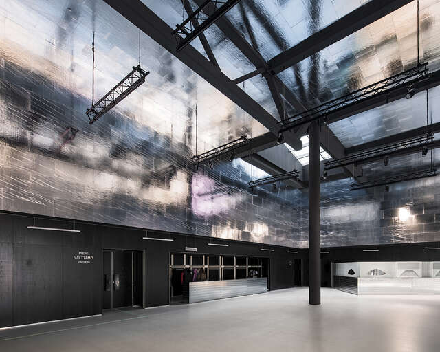 Dark and metallic monochrome interior.