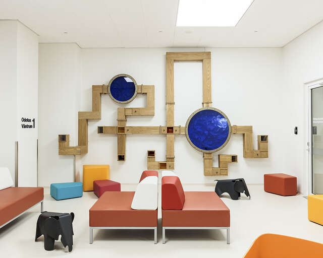 Waiting room with colorful furniture.