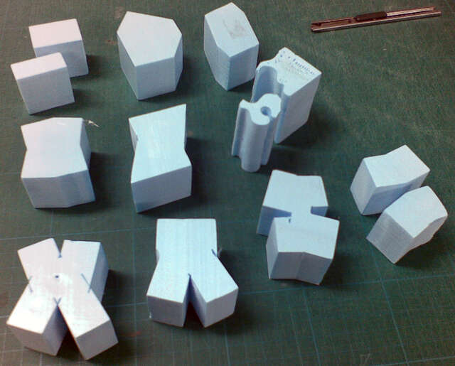 White miniature models of building shapes
