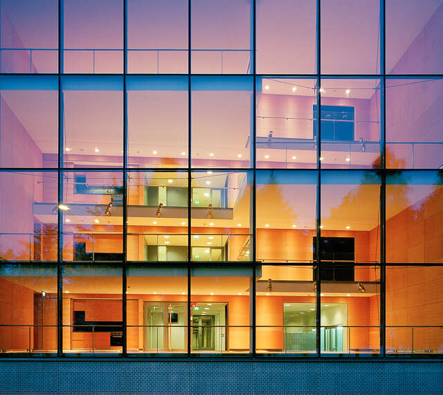Glass façade detail with illuminated interiors