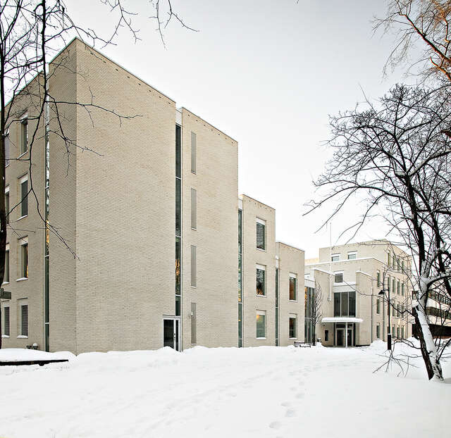 university facade with multiple height parts bon. a snowy day.