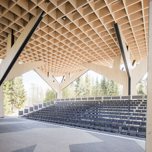 Movable audience seating under the canopy