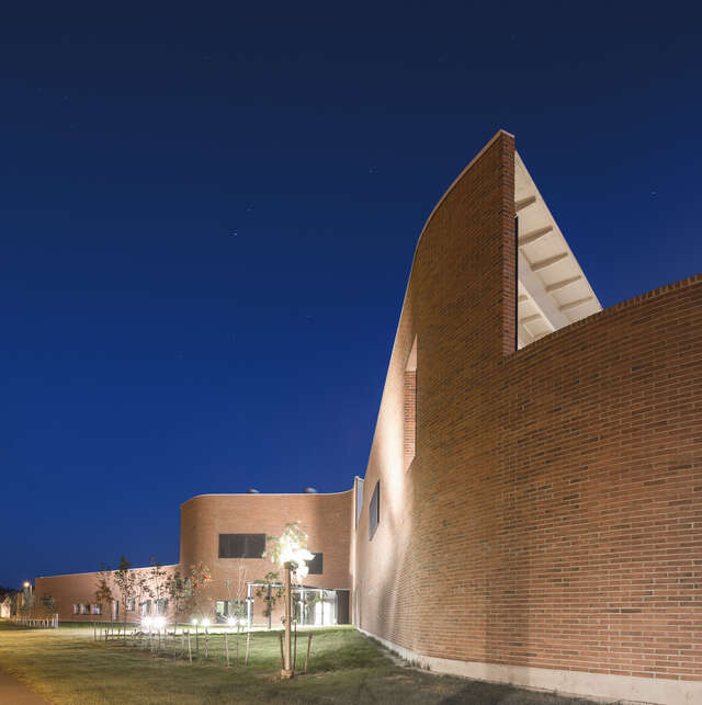 Curvy red brick façade