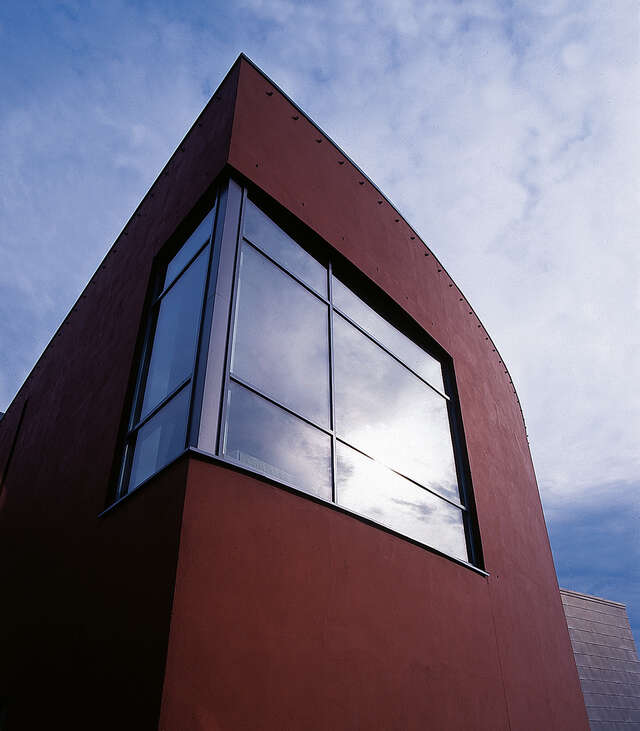 Red facade with a corner window.