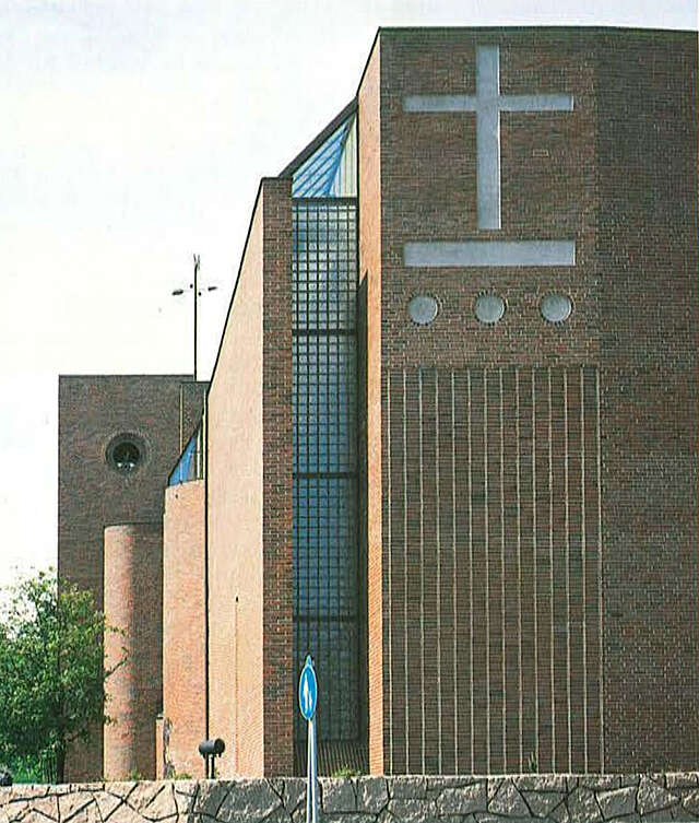 Modernist red-brick church and its bell tower.
