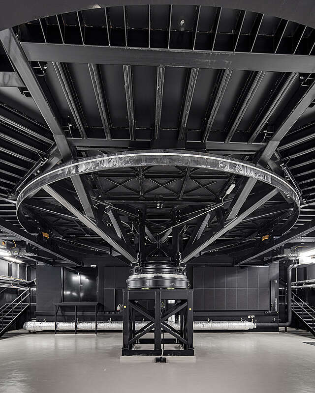 Dark room with metal structures.