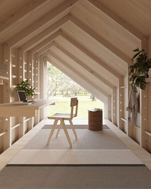 Wooden room with chair and table for working.