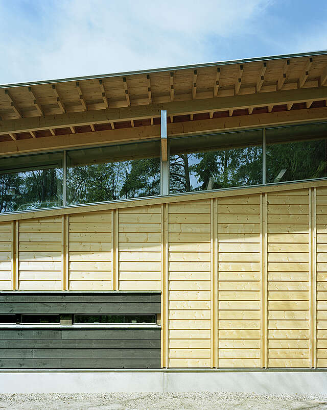 Wooden exterior with a slanted roof.