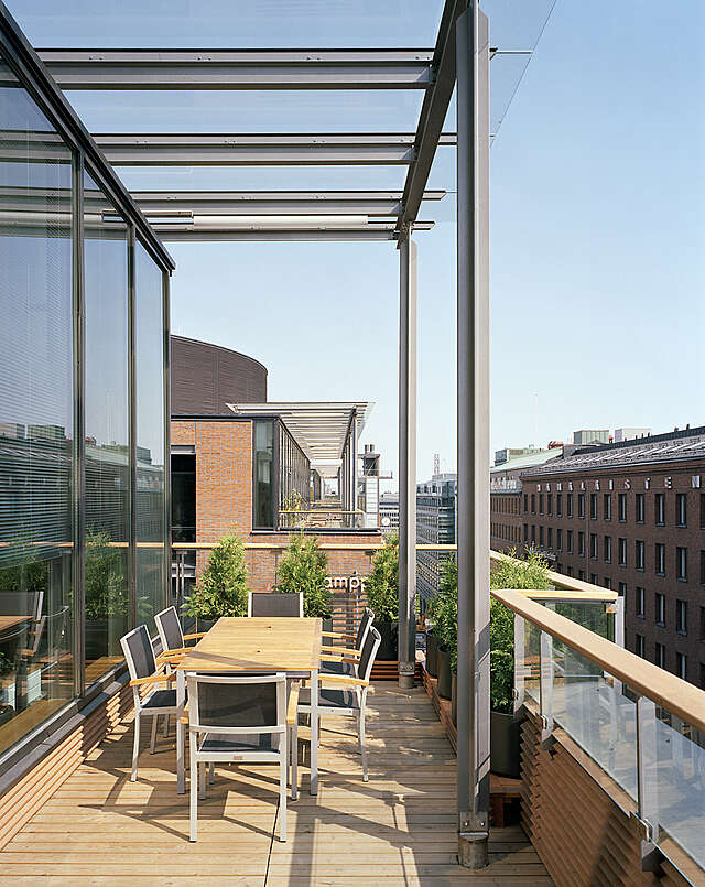 Balcony with a view of the Kamppi brick facade.