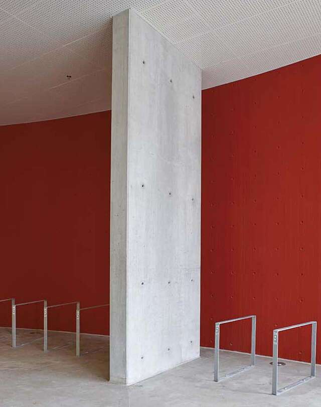 Red wall with concrete beam