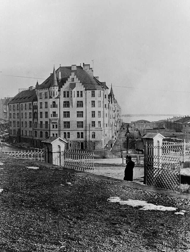 Black and white picture of the multiple storey building facade.