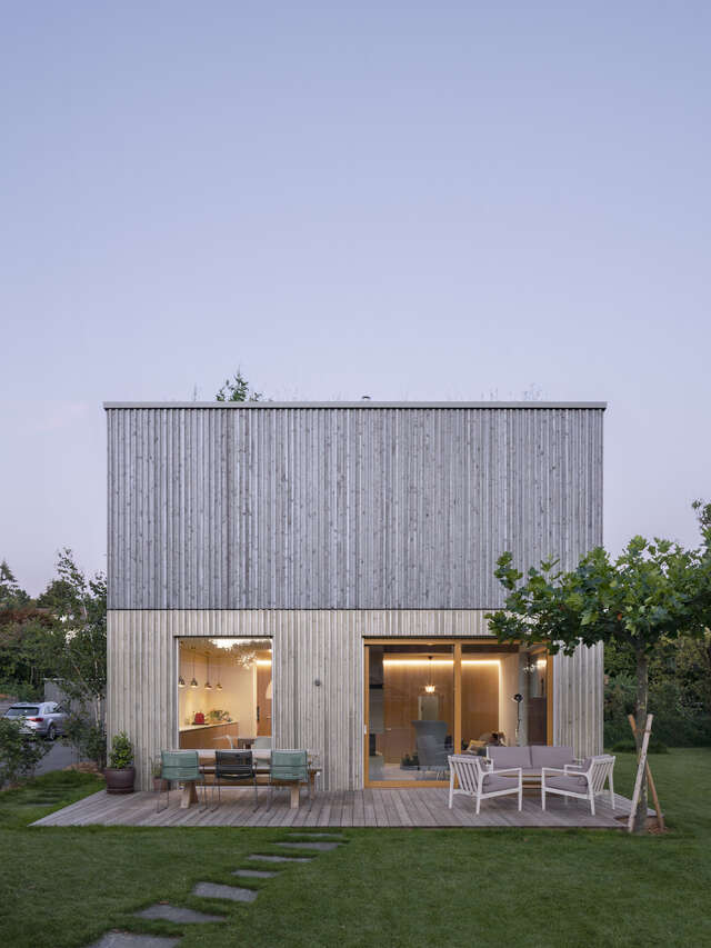 A square building with different shades of grey.