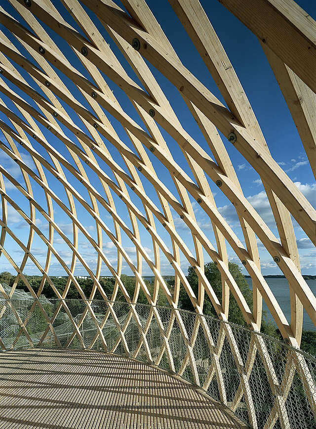 Wood sculptural observation tower with a grid detail shows off the beautiful seaside view.