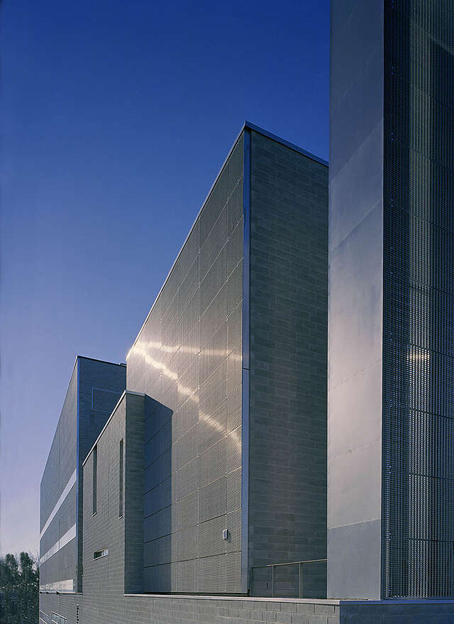 Concrete block and metal grid facade.