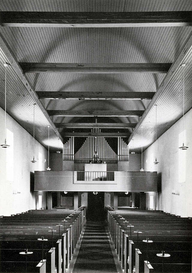 light church interior with wooden elements in black and white