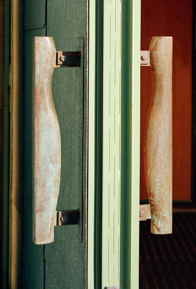 Detail of wavy wooden door handles