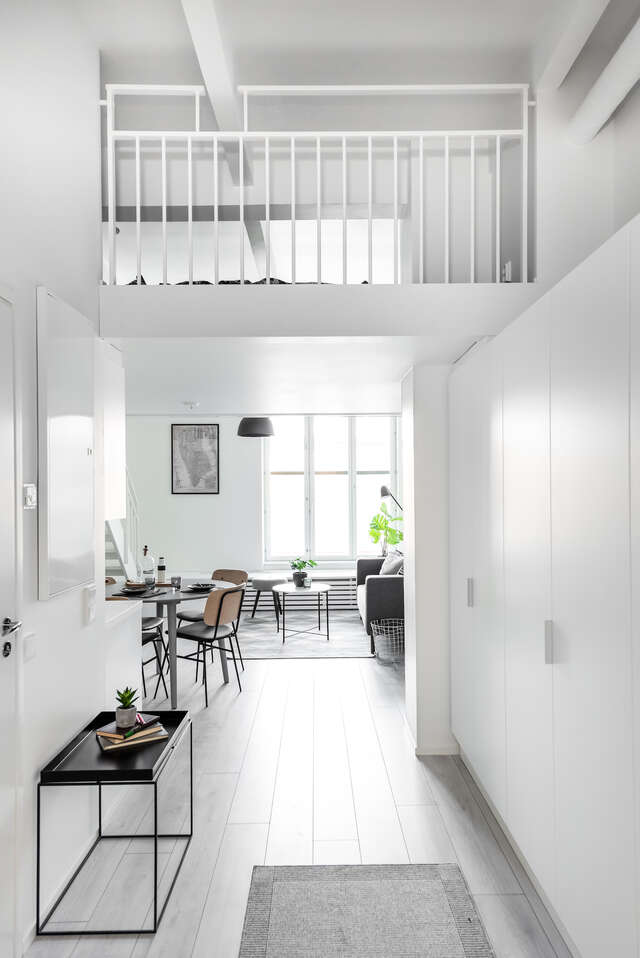 A room with white walls, floors and ceiling.