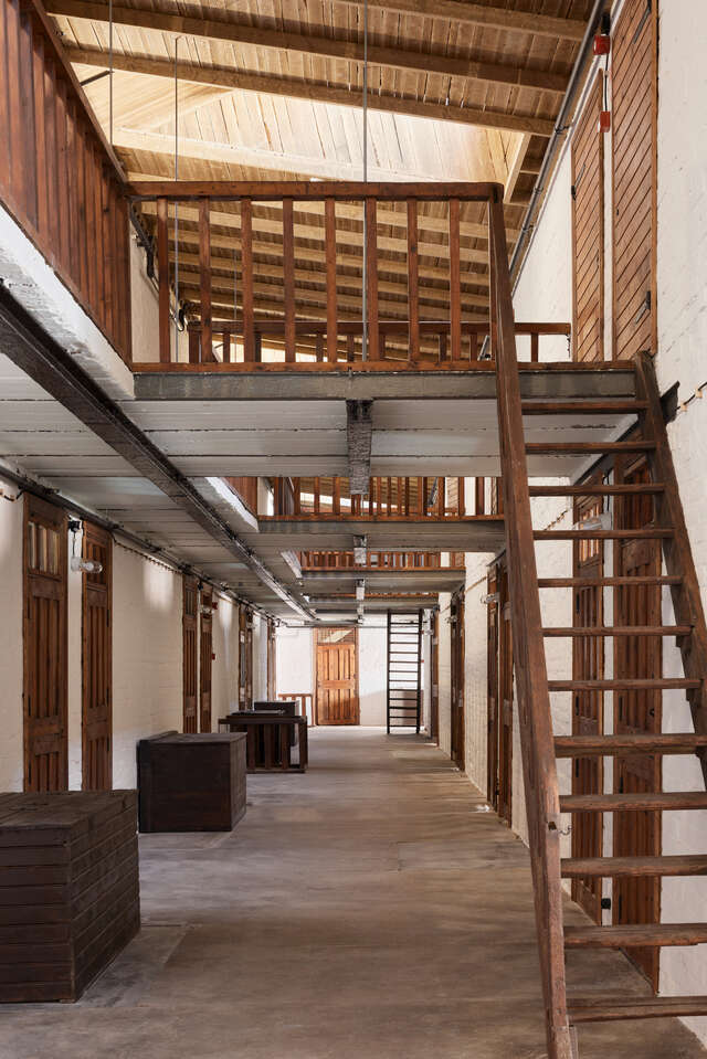 Interior view of an old stable with two levels.