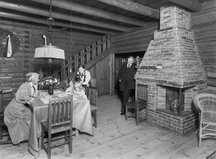 The Sibelius family in 1915 in the dining hall, the green tile fireplace on the left, Aino and Jean Sibelius’ Ainola