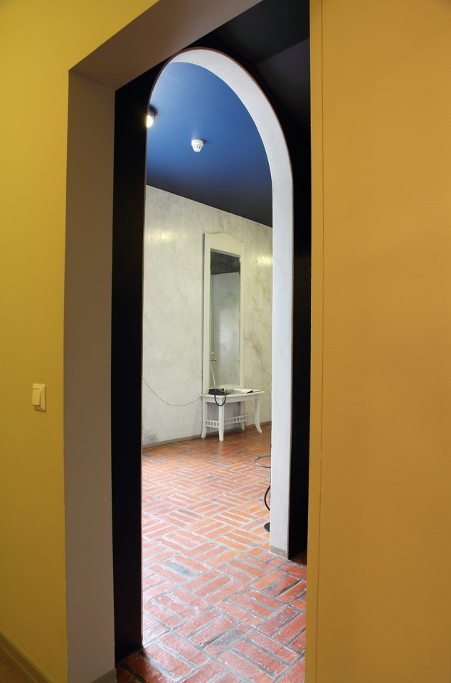 The entrance hall floors are in brick and the walls are finished in greyish white stucco, Villa Solin